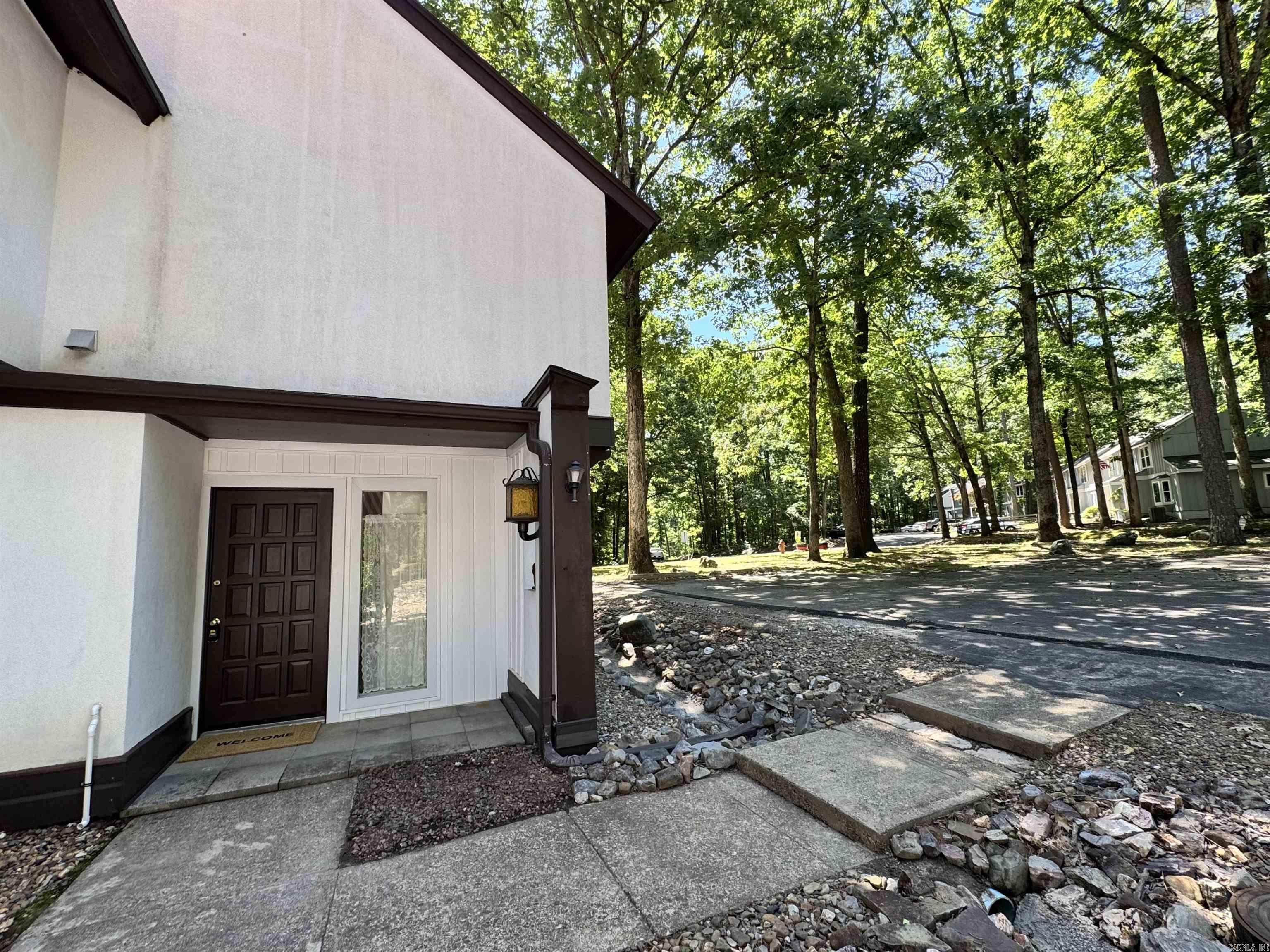 Enjoy golf course views and an unbeatable location near the West Gate on Hwy 7! This beautifully updated townhouse sits directly on the course and is just minutes from shopping, dining, medical services, and recreational facilities. Recent updates include new carpet, paint, plumbing fixtures, hoses/lines, granite counter tops, and stainless steel appliances. The open living area offers a cozy place to relax with a peaceful golf view. Hot Springs Village offers 9 golf courses, lakes for boating/fishing, walking trails, tennis, pickleball, playgrounds, and more. Whether you’re looking for relaxation, recreation, or both – it’s all right here. Permanent residents may qualify for the $500 Homestead Exemption—annual taxes around $250! Don’t miss the opportunity to own this cozy, low-maintenance, and golf view property in one of Arkansas’s most sought-after gated communities. Schedule your private showing today and experience the charm of Hot Springs Village living!