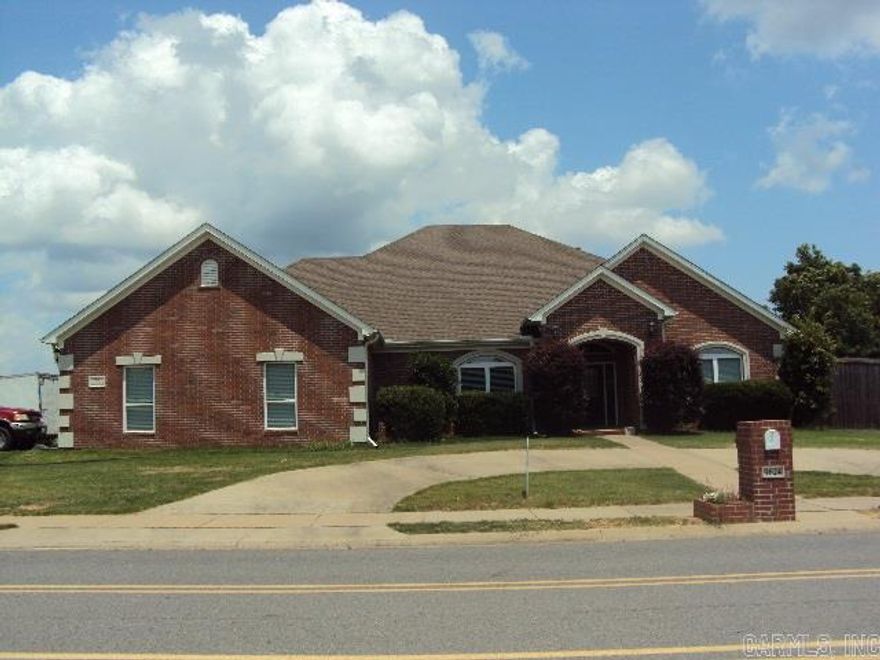 Beautiful 3BR/2.5BA home on corner lot, 3 car side loading garage. Features formal living room double fireplace, dining room, family room, 12 ft ceiling, crown molding, new floors 2017, bar with built-in China cabinet. 4 Door refrigerator, double oven, island with gas range, storage in attic, brick storage building, built-in alarm system, & much more.