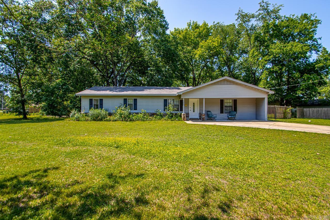 Adorable updated home on a spacious corner lot, located close to town, easy access to highway, schools and shopping, but has privacy & that desired country feel! Open floor plan with natural light, updated kitchen with stainless steel appliances, new stone countertops and plenty of space for a growing family. There are 4 good sized bedrooms and 2 updated bathrooms. Fourth bedroom could be used for additional family room. Perfect starter home or investment! Large corner lot is over half an acre, provides added privacy and plenty of space for a garden, outdoor activities or future expansion! Large patio area in back yard and additional concrete slab for a future shop or additional parking. Partially fenced back yard and small storage building. Eligible for RD Loan.