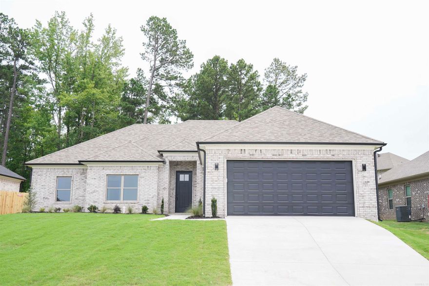 This exquisite new construction home boasts 4 bedrooms & 2 baths, featuring an expansive open concept layout & a sought-after split floor plan. The lavish living room offers ample space for entertainment & relaxation, complete with a sophisticated fireplace that adds a touch of elegance to every gathering. Retreat to the spacious primary suite, where you’ll discover a haven enhanced by an oversized walk-in tile shower & luxurious double vanities for added convenience. The gourmet kitchen is a culinary masterpiece, showcasing a stunning stain-grade accent island, upgraded appliance package, & under cabinet lighting that illuminates the space with style. Throughout the home, you’ll be captivated by the allure of SPC flooring - an upgrade from LVP, designer light fixtures, & generously proportioned spare bedrooms. Spare bath complete with a full shower/tub combo! Step outside to the covered porch & immerse yourself in the tranquility of the surroundings in the fenced backyard. Prepare to be amazed by this must-see home that epitomizes modern living. Don't miss out on this one!