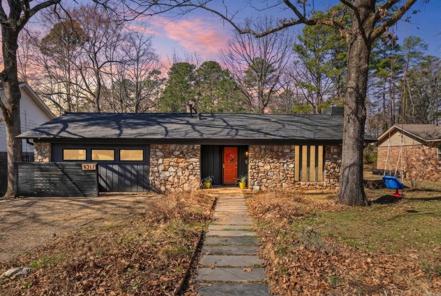 Beautifully updated Leawood home with a low-maintenance Certified Arkansas Wildspace. This charming & thoughtfully updated 3-bedroom, 2-bathroom home in the heart of Leawood, perfectly positioned just minutes from restaurants, shopping, and everything central Little Rock has to offer. This property backs directly up to a green space & features a Certified Arkansas Wildspace, giving you a serene, low-maintenance outdoor environment. The open-concept layout creates an easy flow between the kitchen, dining, and living areas. A vaulted ceiling in the living room adds volume and character. The living room features a wood-burning stove with flue pipe, adding warmth, charm, & efficiency. Whole-house generator (2023) for uninterrupted comfort. New roof (2024) and new gutters (2024). New fence (2020). Additional insulation (2023) to improve energy efficiency. A versatile bonus room offers endless possibilities, home office, kids playroom, guest space with a Murphy bed already installed for maximum functionality. Step outside to the backyard with a beautiful wooden bridge that crosses over a creek, leading to additional usable land, perfect for exploring or relaxing. Agents see remarks.