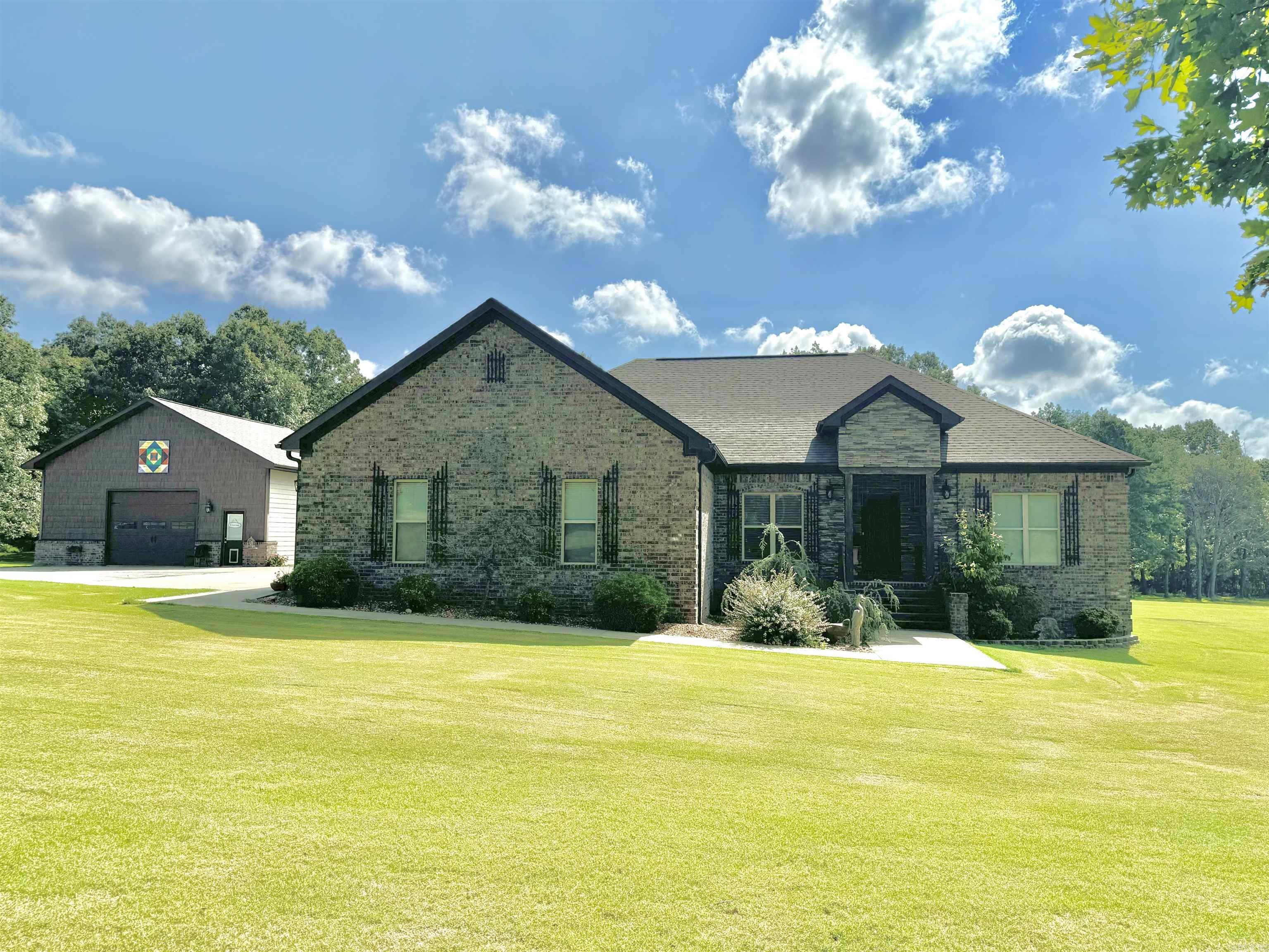 This immaculate BRICK HOME sits on 4.5 acres and offers a perfect blend of comfort, luxury, and functionality! The open concept living space is ideal for modern living, featuring a custom kitchen equipped with beautiful alder cabinets, quartz countertops, stainless appliances, a cozy breakfast nook, and a spacious open dining area. The master suite offers a large bedroom with access to the back patio, walk in shower, jacuzzi tub, and large walk in closet. Located off the back patio is an in-ground saltwater swimming pool, complemented by a pool house that includes a fully equipped kitchen, bathroom, and secure safe room. The home has an attached two vehicle garage with additional storage above and a detached garage with a lean to. Conveniently located on a paved road in a prime location, this property is a rare find! Don't miss out on the opportunity to call this property HOME!