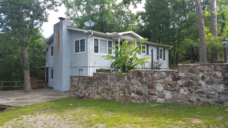 Available by Dec 1st. SEQUOYAH LAKE VIEW! Within blocks of public access to Lake Sequoyah, Lake Cherokee & Lake Thunderbird.  1296 sq ft on main level with 2 bedrooms and mostly hardwood floors. Open kitchen/living dining area. Main bath has garden tub & walk in shower. Bonus room perfect for office or play room.  Lower level is 1350 sq ft with 2 more bedrooms and 3/4 bath.  Another kitchen, family room with a wood burning fireplace w/insert and another bonus room.  Laundry area is also on lower level. No Carpet!  Large deck to enjoy the view and 2nd lot for privacy. This home has lots of space to enjoy your hobbies. Each adult is required to complete an application. Pest control, liability insurance and credit reporting services is an added charge on rent monthly.