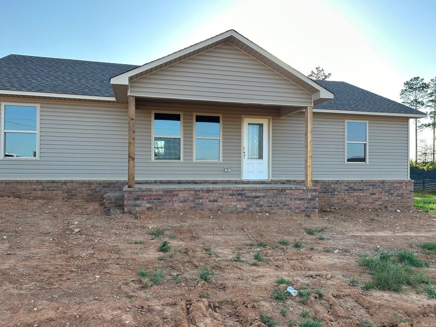 Beautiful new construction 3-bedroom, 2-bathroom outside city limits, but close to town! Spacious living room, kitchen & dining area and laundry room. Ceiling fans are in all bedrooms and living room. These pictures do not do this new construction home justice! A must see.  Completion should be by end of August, more photos to come.