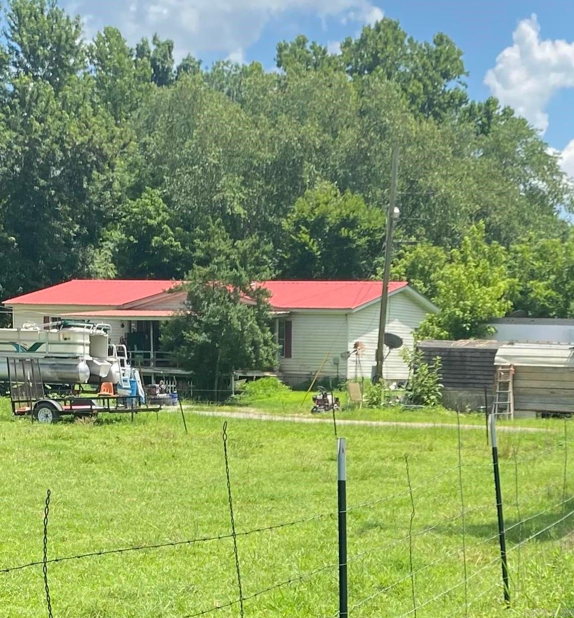 Looking for privacy, space, and a little slice of country heaven? This one's for you! Sitting on 4 beautiful acres, this property offers all the peace and quiet you could want - with a creek running through it! Yes, you can literally go tubing in your own backyard! Weather your dreaming of room to roam for the kids, a spot to let the dogs run free, or just want your own private retreat, this place checks all those boxes. Don't miss your chance to snag this rural gem. Call today for a private showing!