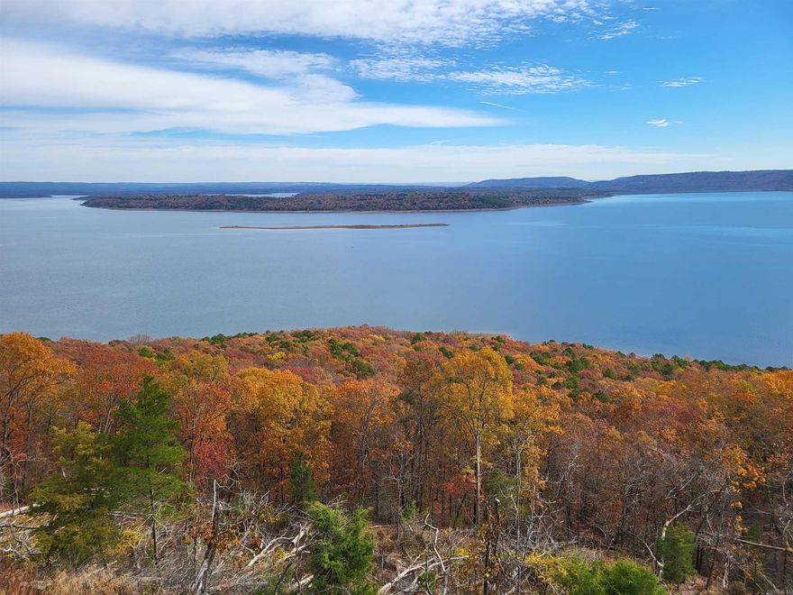 Fabulous lake frontage of 139.93 feet with spectacular views on high bluff. Many large trees. Adjacent Tract #20 available. Deed restrictions. Seller financing of  10% down, 20 years at 8%. Detailed brochure. Paved county road. Fiber optic cable internet. Public water, electric, phone, septic. All proceeds go to a Charitable Trust. This is the 2nd best tract on beautiful Greers Ferry Lake! See drone video attached and other videos plus photos. For more details , see our website.