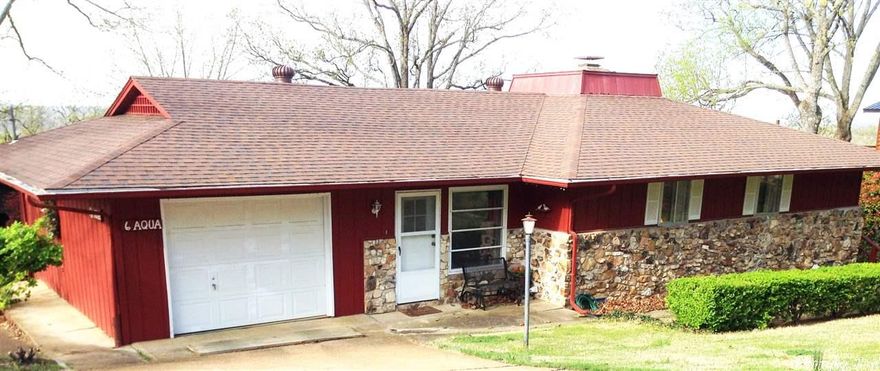 INCREDIBLE VIEWS !!! Step onto covered back deck off living room & you will enjoy the most beautiful views-you can see for miles! Vintage hardwood flooring in living room-dining, & 2 bedrooms! ATTACHED GARAGE! Family room between garage and kitchen & enjoys a lovely faux fireplace.  Living rm has large fireplace with gas logs- lots of built-ins. Downstairs is accessed from outside & has great finished space -including 3rd bath! home has it all all-needs a bit of updating but will make you the perfect home!