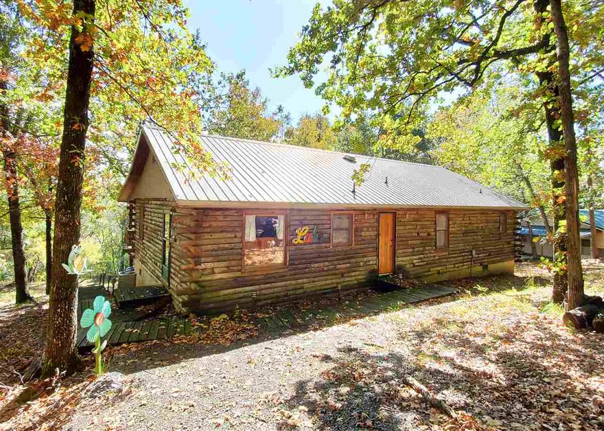 MOTIVATED SELLERS! RD & VA 0% Down,3.5%FHAT down this majestic log home is lake view and lake front, with a sandy beach at the lake shore. Built in 1985 with 6" pressure treated custom cut logs, redwood&white pine ceilings & walls. Medeco Security door locks, 3" handmade solid oak exterior doors and free standing wood burning stove. Has a beautiful back deck to over look the lake with a easy walk to the water. This is a Must see! You cannot find a cabin like this ANYWHERE for this price on Greers Ferry Lake