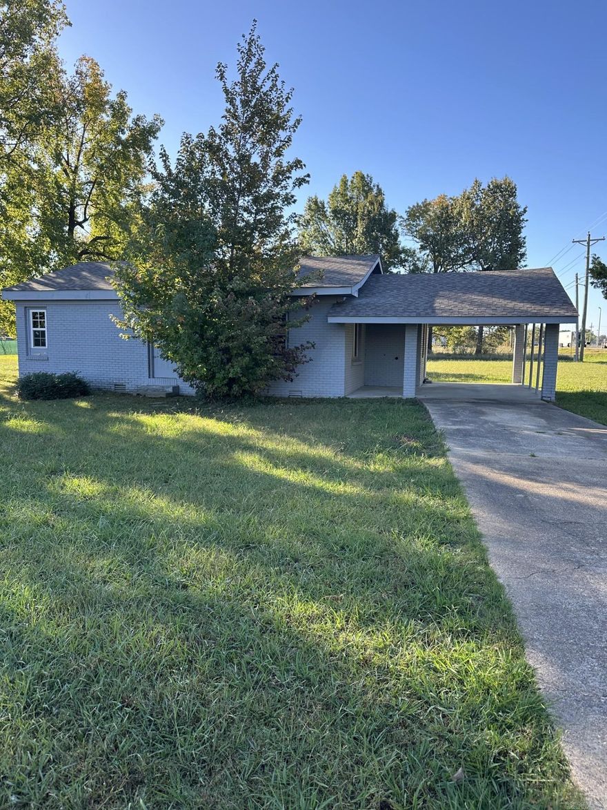 High traffic commercial property off of Red Wolf Blvd. on .96+/- of an acre. Building has great potential. All brick with new windows.