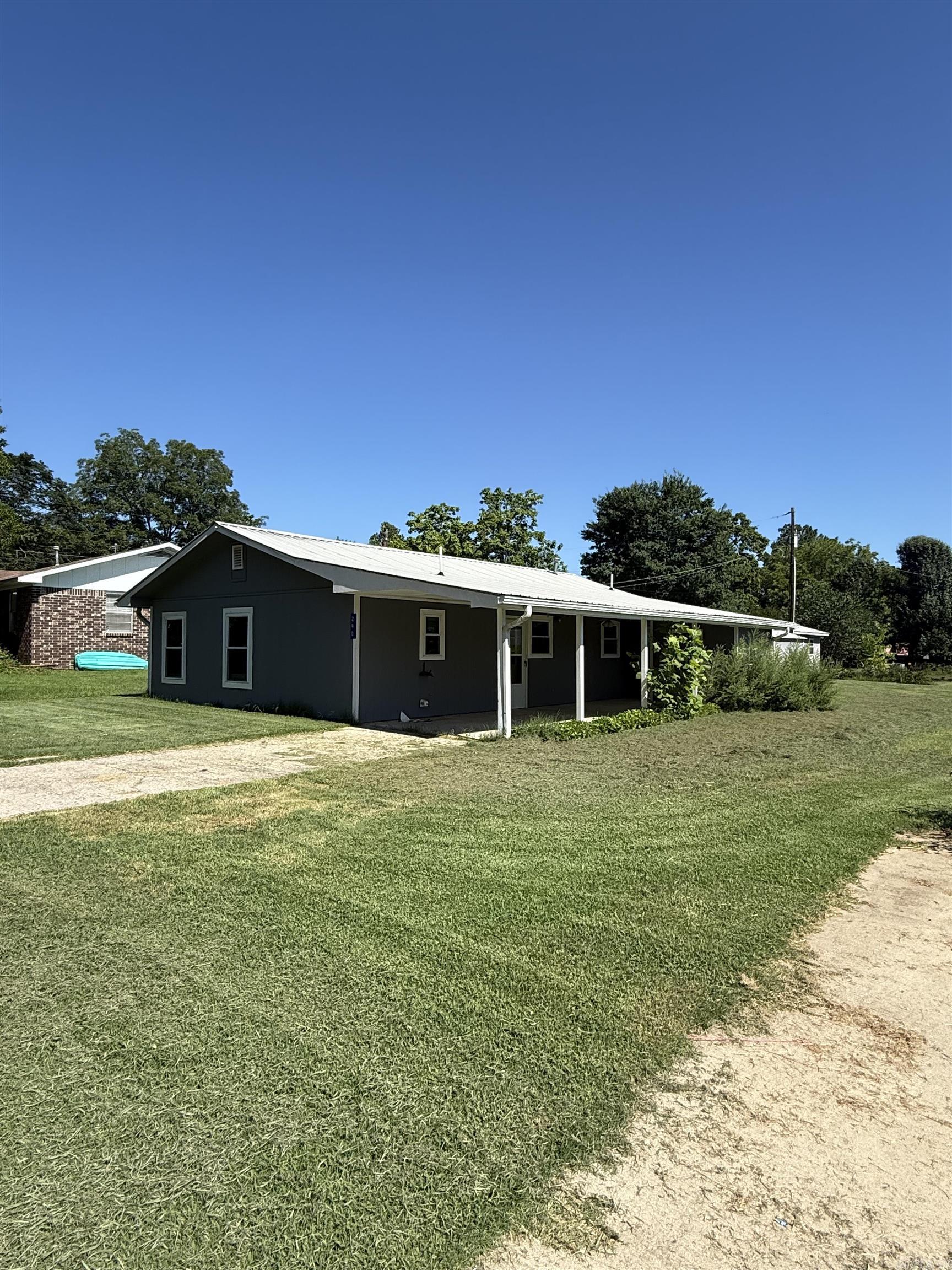 This wonderful little two bedroom one and a half bathroom home sits on almost half acre with a storage building and a storm shelter on property. The home is within walking distance to Clinton public schools and several eating establishments also within five minute drive of Walmart and local doctors offices Greers ferry Lake and other amenities are just a few minutes away from the house.