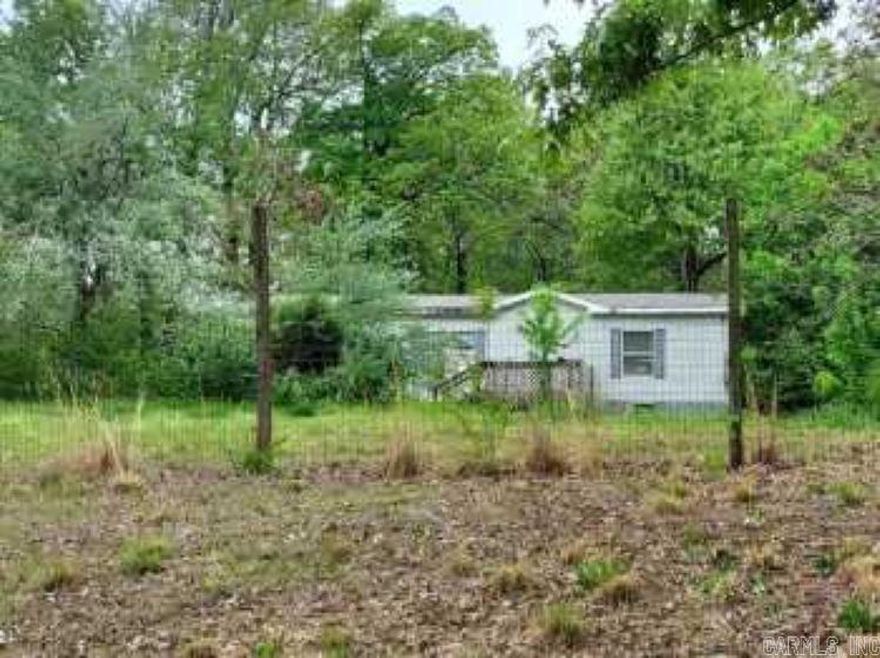 Many opportunities here, a fixer upper 1568 sq ft double wide and an older single wide mobile home, plus a large shop with office.  All this on 3.5 very pretty acres, large shade trees, if you are looking for a place to build or fix up what is here, plus looking for a business location, take a look.