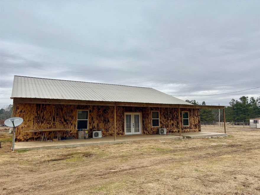 Major price change!! New construction home with 4 bedrooms/ 3 baths, a shop & 39 acres!! Open floor plan kitchen, dining and living room. Pantry in the kitchen and a separate laundry room just outside the kitchen.  Electric range, two tankless gas water heaters and 6 mini split units. Large bedrooms and bathrooms & each bedroom has a spacious closet.  Outside you'll find a fenced pasture and nice pond.  The mobile home on the front of the property will be moved. You can't build for this price!  Take a look and have your own piece of paradise.