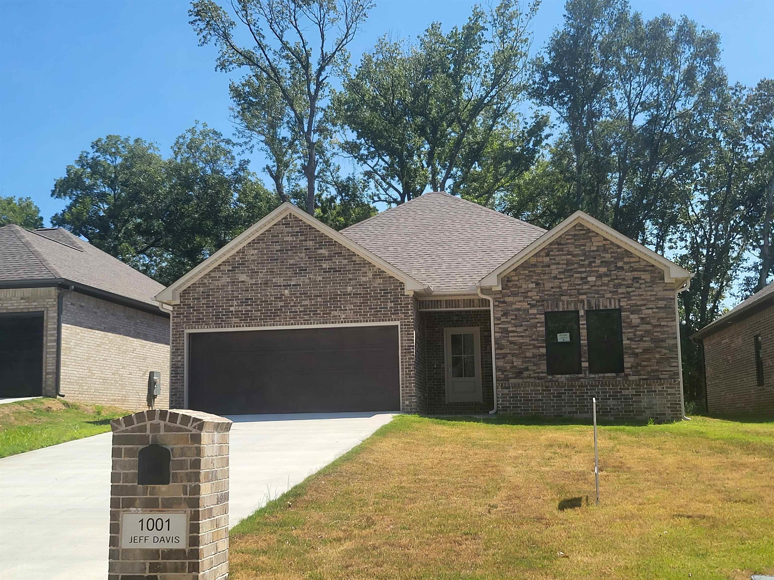 Why rent when you can own this stunning new construction home at 1001 N Jeff Davis Ave in Jacksonville, AR! Perfectly located between the Little Rock Air Force Base and easy interstate access, this home offers the best in convenience and style. Features include a spacious lot, 9-ft ceilings, upscale finishes, all-wood cabinets, solid surface countertops, designer light fixtures, custom tile backsplashes, and abundant natural light. The primary suite boasts a luxurious walk-in tiled shower. Modern design, premium craftsmanship, and a prime location make this home the perfect choice for military families, first-time buyers, or anyone ready to upgrade their lifestyle. Schedule your private showing today! (1.1 miles to Walmart, 1.3 miles to Kroger)