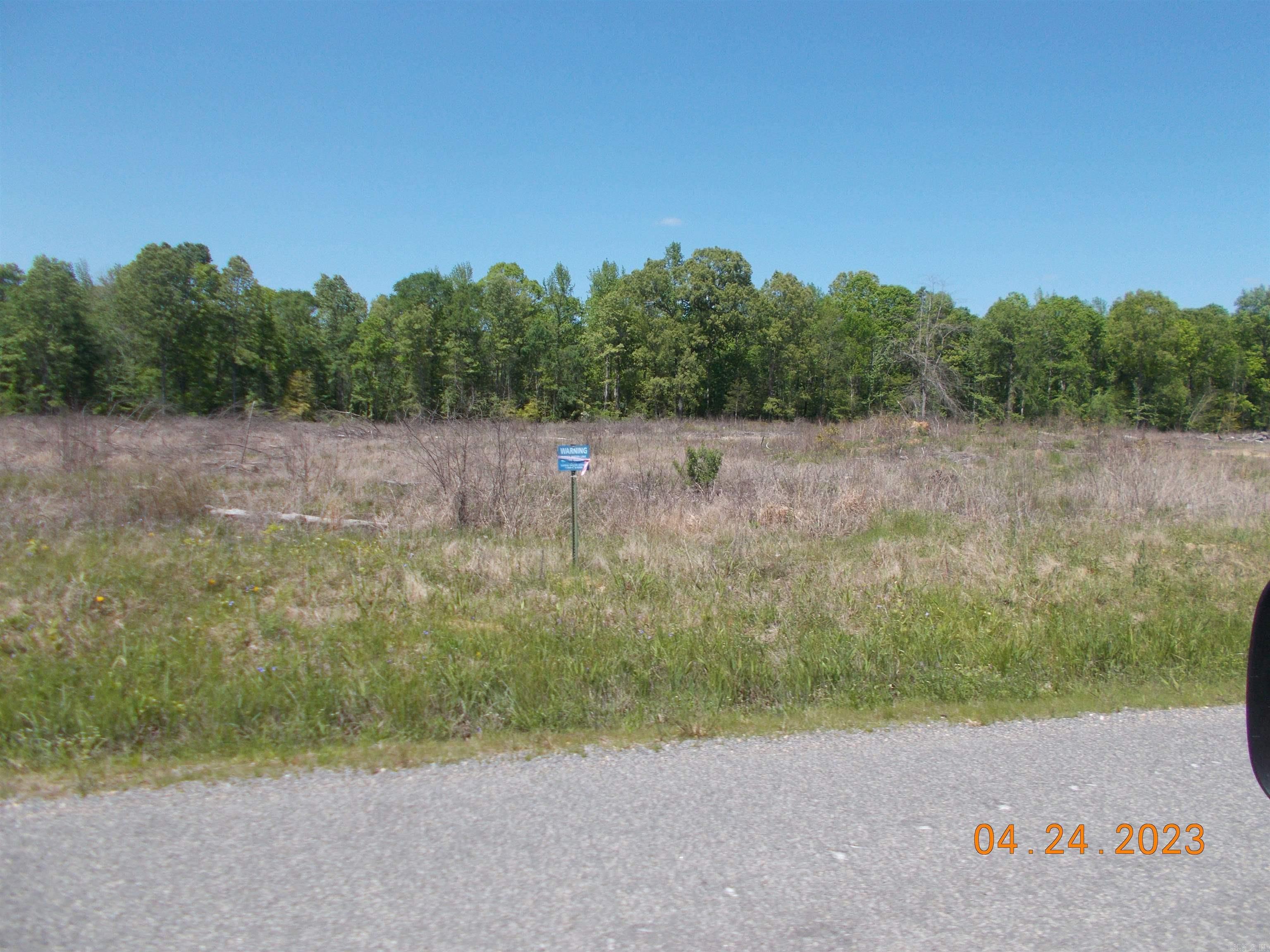 Property narrow but deep in layout. Wet weather creek toward back. Front half of tract was cut about 3 years ago. Has been prelim perked (letter in documents) Restricted to houses with mininum square footage of 1000 sf. (deed restrictions in documents) Sardis Water available at road, Electricity at road, Windstream/Go Kinetic fiber internet and gas is to the east and might be able to be extended....would need to contact Summit Utilities. No manufactured/mobile home that is five (5) years or older from the date on which it was manufactured will be allowed on any tract or parcel/lot.