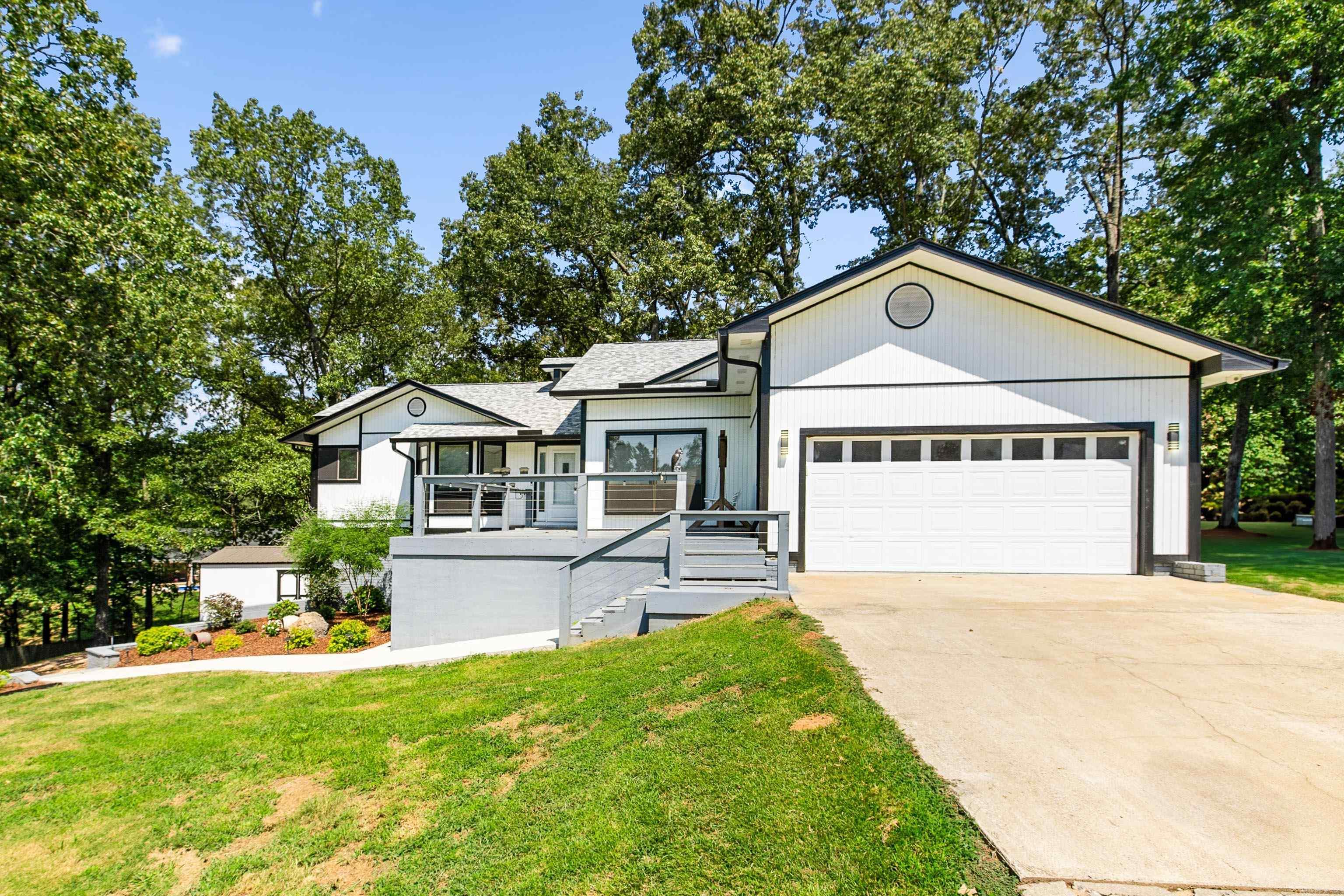 Spacious 4-bedroom, 2-bath home situated on 1.7 acres in Benton School District. The open-concept floor plan features vaulted ceilings, a tongue-and-groove accent wall, and large windows that provide natural light and beautiful views of the surrounding trees and wildlife. The great room offers an impressive gathering space, while the oversized kitchen provides ample room for cooking, dining, and entertaining. This property has been well cared for with numerous recent updates, including a new roof in 2024, exterior paint in 2023, new porch and deck boards in 2023, and a tankless water heater installed in 2024. A whole-house generator (2016) provides peace of mind. Outdoor amenities include a 12x30 storage building with electricity and a 28x28 walkout shop that is fully equipped with walk-through and drive-in doors, its own central HVAC system (2016), and water connectionāideal for hobbies, projects, or additional workspace. Enjoy the privacy and wooded setting with scenic vista views from the front, while being conveniently located just minutes from town. This well-maintained property offers a balance of space, function, and comfort.