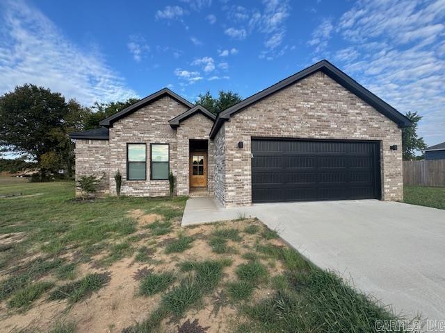 All-brick beauty! This 1-year-old, 3 bed/2 bath. home features an open floor plan, stainless appliances, fireplace, walk-in closets, tiled walk-in shower, covered back porch, and fenced yard.