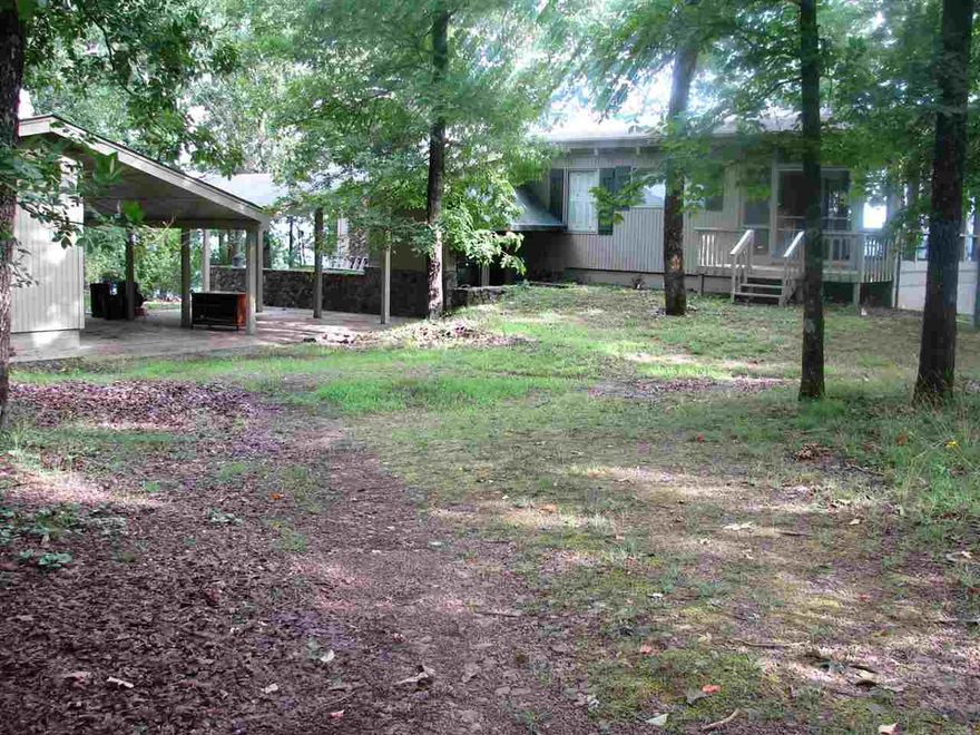 What a view! This well built older home has some of the best views  around the lake - Sunrise, sunset and the lake and Ozark foothills. Features a vaulted ceiling great room and kitchen with the fantastic view on the upper floor as well as a lower level living room with the same view. Both rooms have wood burning fireplace. 3.5 total acres for privacy. Porches and decks to enjoy the outdoors and wildlife. Two large bedrooms and one small one for the kids! Peace and tranquility behind the secure gate.