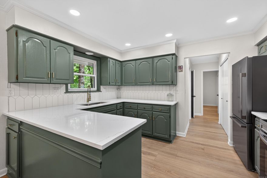 Fully Remodeled and Move-In Ready with a Private Wooded Backdrop. Experience modern elegance in this stunningly renovated home located in the desirable Gerona subdivision. Every inch of this property has been thoughtfully updated to provide a seamless blend of style and comfort in a quiet, established neighborhood.  The gourmet kitchen features beautiful quartz countertops, modern cabinetry, and high-end finishes. The versatile floor plan offers 3 spacious bedrooms and 2 full baths, easily functioning as a 2-bedroom with a dedicated home office. Enjoy year-round living in the fully heated and cooled Arkansas Room, perfect for taking in the peaceful scenery in any season.  Step out onto the brand new back deck overlooking a very wooded and private backyard, an ideal spot for morning coffee or soaking in the tranquil nature of the Village. Boasting 1,384 square feet of fresh interior space, this home includes updated flooring, contemporary fixtures, and a neutral palette throughout. New HVAC, Plumbing, and electric. Located just minutes from the West Gate. This is the like-new Village retreat you have been searching for.