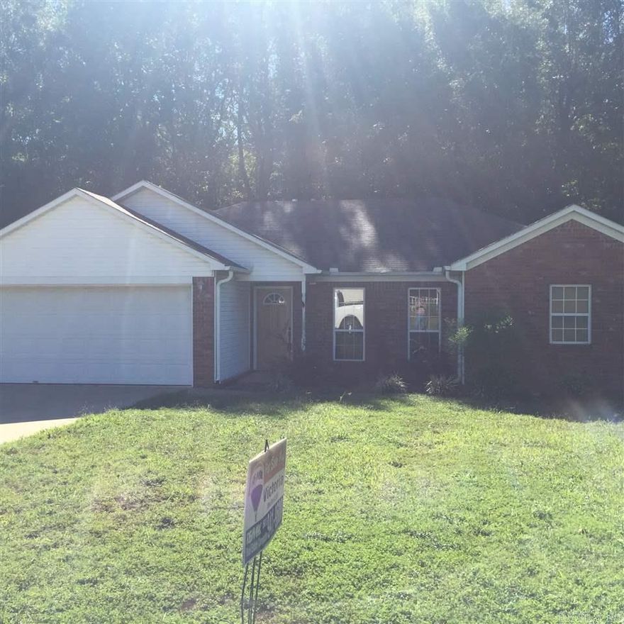 Nice home with great backyard looking trees.  Brick and siding home with 3 bedrooms and 2 baths.  New laminate, carpet, and tile floors throughout.