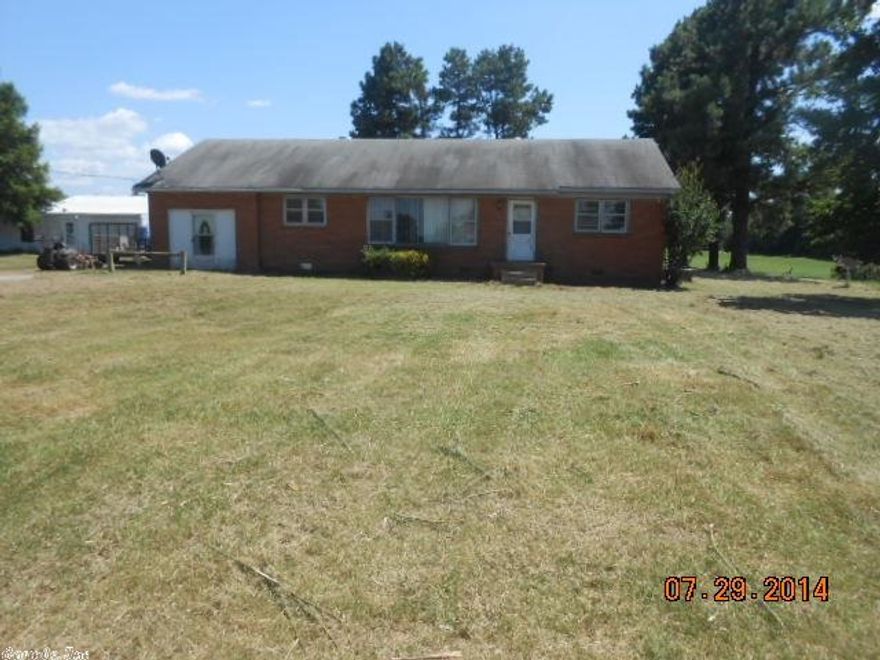 Country Living... All brick home setting on 1.18 acre lot with beautiful shade trees and a workshop. 3br 1ba home at nearly 2,000 SqFt does need a lil TLC but would make great Investment or Starter home. Call or txt today to set up a showing appointment! (This property is to be sold "AS IS")