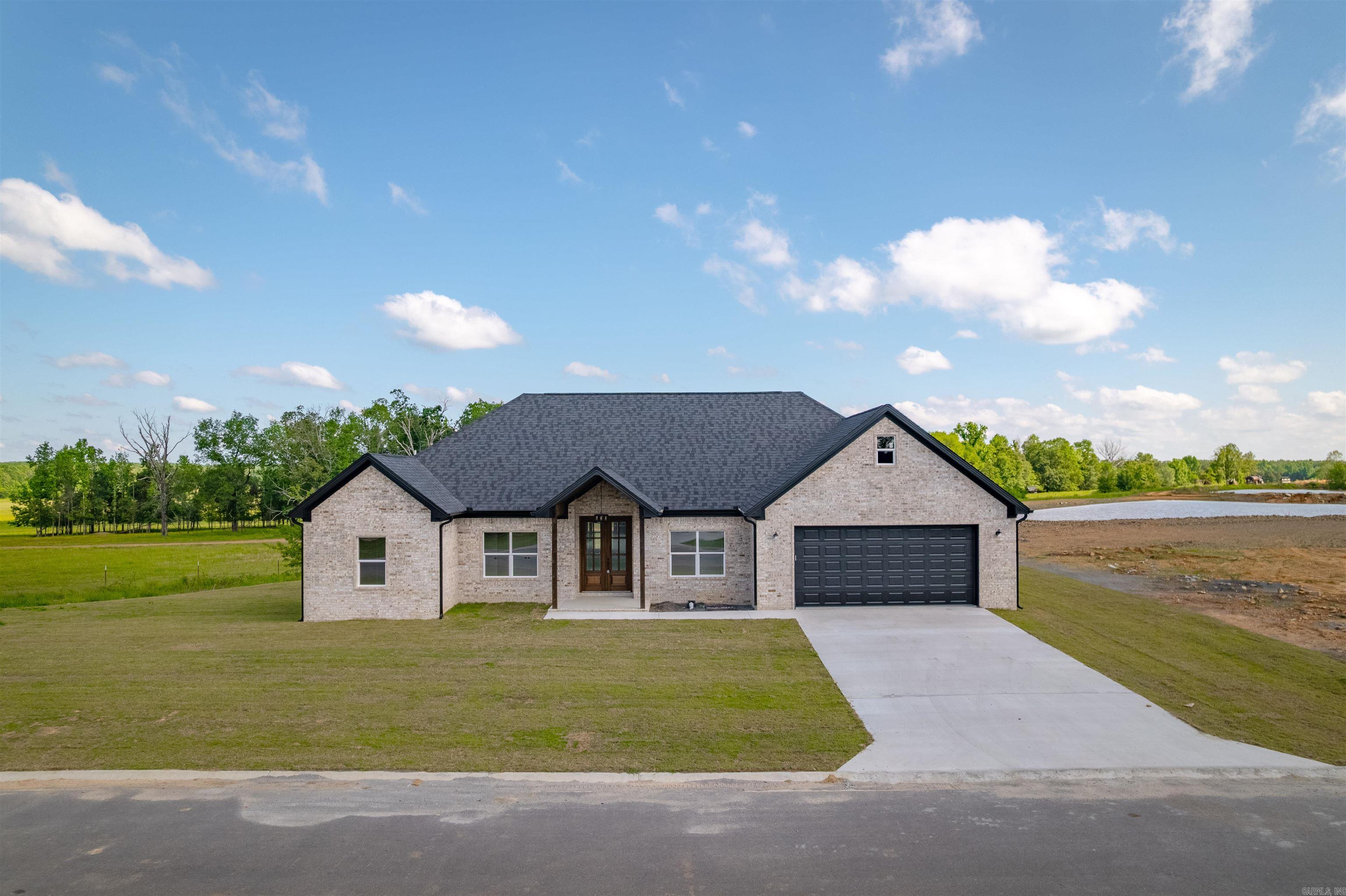 Welcome Home! This is a stunning home with a great backyard view! This lot is a large lot (see pic) and is presently planned to have a community lake behind the home too! This 4-bed, 2.5-bath house with a split floorplan boasts an ultra open concept too! Checkout the living room, kitchen & dining combo! Entertainment dreams! This home also has a nicely sized walk-in pantry too that will surely please! Stone Countertops throughout the home as well as a soaker tub and a walk in tile shower in the master bath too! $5,000 Buyers Concessions too! Stay tuned! See Agent Remarks.