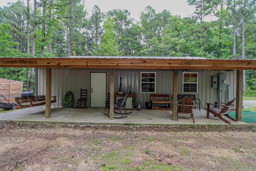 Secluded, Peaceful and Serene best describes this 1200 sq ft shop house sitting on 20 acres with mature trees, rolling hills, trails for ATV's and PRIME hunting ground with the pictures to prove it! The 2 bedroom and 1 bath home features an open floor plan with insulated overhead door that would be perfect to open on those cool fall nights and enjoy the weather. Storage shed out back to hold supplies and there is a covered porch with a swing to soak up the outdoors!