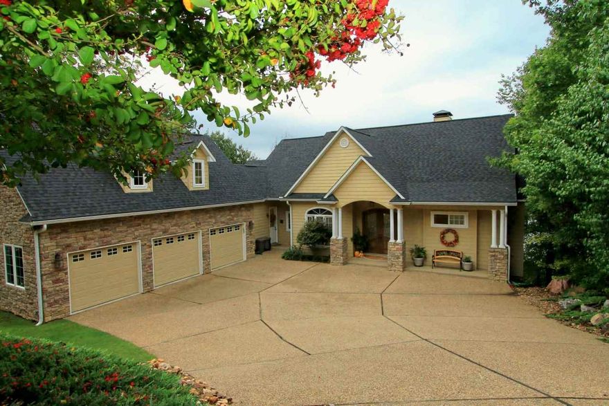 This stunning home, built in '06 features two levels of exquisite living space for a total of approximately 4000 square feet.  This home is constructed of hardy plank and cultured stone and offers a three stall garage, an unfinished room over the garage (31 x 12), as well as breathtaking lake views from nearly every room.  You will love the open floor plan with its walls of windows, 8 foot doors throughout and covered patios plus screen porch.  Amenities abound!