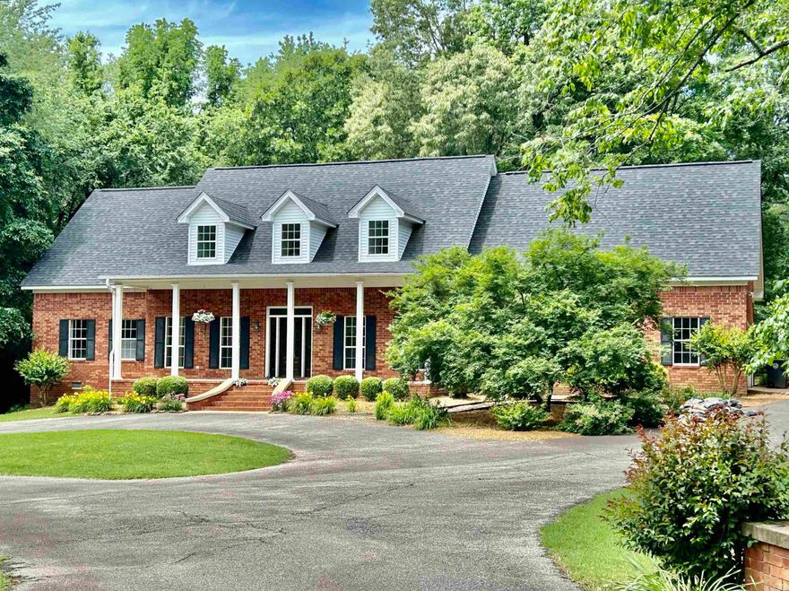 One of the most beautiful homes in Country Club East addition in Searcy is  waiting for the next family to love it. Located in a cul-de-sac, 15 Robinwood has 3538 sf, 4 bedrooms, 2. 5 baths plus a giant bonus room and a saltwater pool is nestled in an idyllic setting with beautiful trees, a bridge and a creek. Master bath is updated for ultimate relaxing. Pella windows, gas logs, views of a beautiful front and back yard and custom storage plus a laundry chute. New carpet upstairs, three car garage and more! Entrance from the 3 car garage is about 3 inches making it perfect for everyone. Granite counter tops throughout. Porches offer beautiful views of nature in the front and back yard. A bay window in the kitchen overlooks the pool. These are just a few of the custom finishes on this two owner home. A piece of heaven on earth is ready for the next family to make this their home. Sellers are offering a $5000 paint allowance. Roof and pool are 7 years old. This home is move-in ready and a rare find in Searcy. Don't miss this one and start making memories.