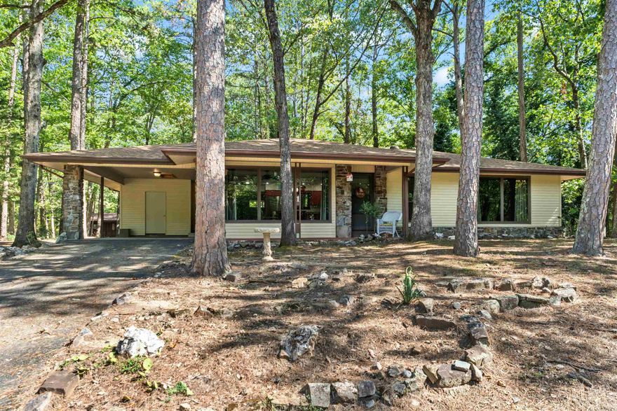 This charming West side home is over 1700 square feet with beautiful views from the newly replaced (2024) floor to ceiling living room windows. The kitchen has newly updated, stainless-steel appliances that were replaced in 2024 and transitions nicely into the oversized family room with wood-burning fireplace. The home includes a spacious storage room (storage room measures 19’ x 5’3”) 2 bedrooms, 2 baths, laundry room, and fenced backyard all these features make this home stand out.  Time to embrace the Village lifestyle. This home offers both function and warmth. Great opportunity for affordable living in Hot Springs Village.