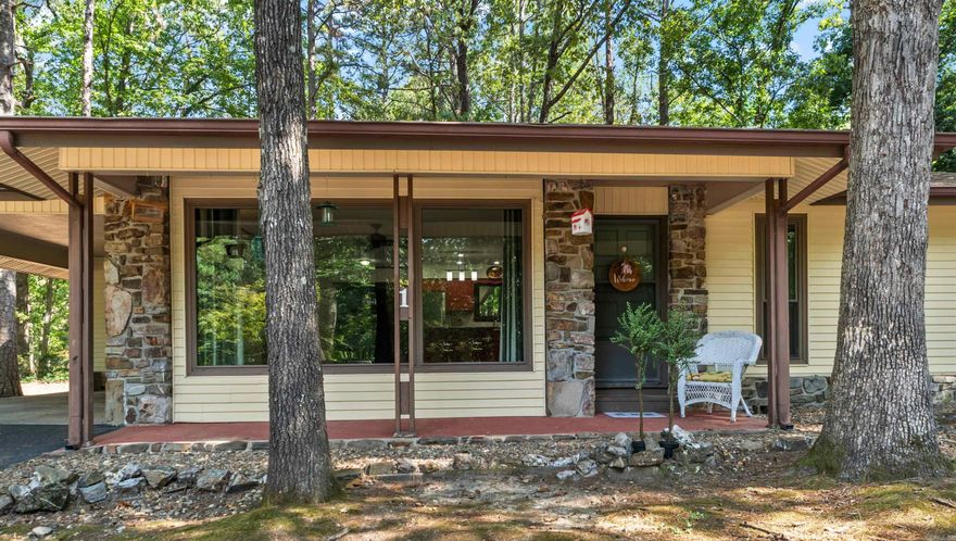 This charming West side home is over 1700 square feet with beautiful views from the newly replaced (2024) floor to ceiling living room windows. The kitchen has newly updated, stainless-steel appliances that were replaced in 2024 and transitions nicely into the oversized family room with wood-burning fireplace. The home includes a spacious storage room (storage room measures 19’ x 5’3”) 2 bedrooms, 2 baths, laundry room, and fenced backyard all these features make this home stand out.  Time to embrace the Village lifestyle. This home offers both function and warmth. Great opportunity for affordable living in Hot Springs Village.