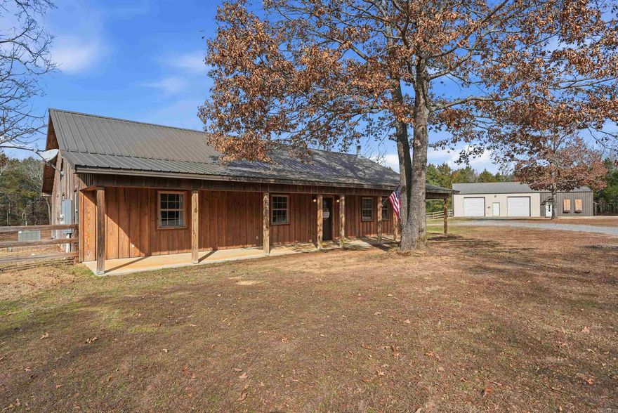 Looking for privacy, this is it! Welcome to 18 Kenwood Cove, a secluded 9.75 acre property with no restrictions. Step inside the 3 bed, 2 bath home with an open layout, vaulted ceiling, wood burning fireplace, plus covered front and back porches.  Relax in the hot tub and soak in the peaceful views. Property features a serene pond (seasonal), a 40x40 shop with a fully equipped 20x40 1 bedroom, 1 bathroom apartment and tornado shelter, greenhouse, chicken coop and a pond. The shop apartment adds flexibility for guests, rental income, workspace or a fun gathering spot for family and friends. Additional 10x60 lean-to behind shop. Opportunities like this do not come often, schedule your showing today and take the next steps towards making this private retreat your next home. Agents see remarks.