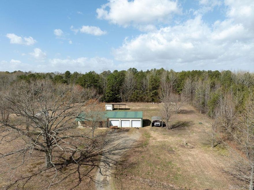 Escape to this barndominium on 7.79 acres near beautiful Greers Ferry Lake! This unique home offers modern comfort featuring an open floor plan, spacious living areas, and plenty of natural light. The property includes a large three-car garage, perfect for vehicles, boats, or storage. Set back off the road for added privacy, the partially fenced land provides space for pets, livestock, or outdoor enjoyment. Whether you're looking for a peaceful retreat or a place to entertain, this home offers the best of country living just minutes from the lake.