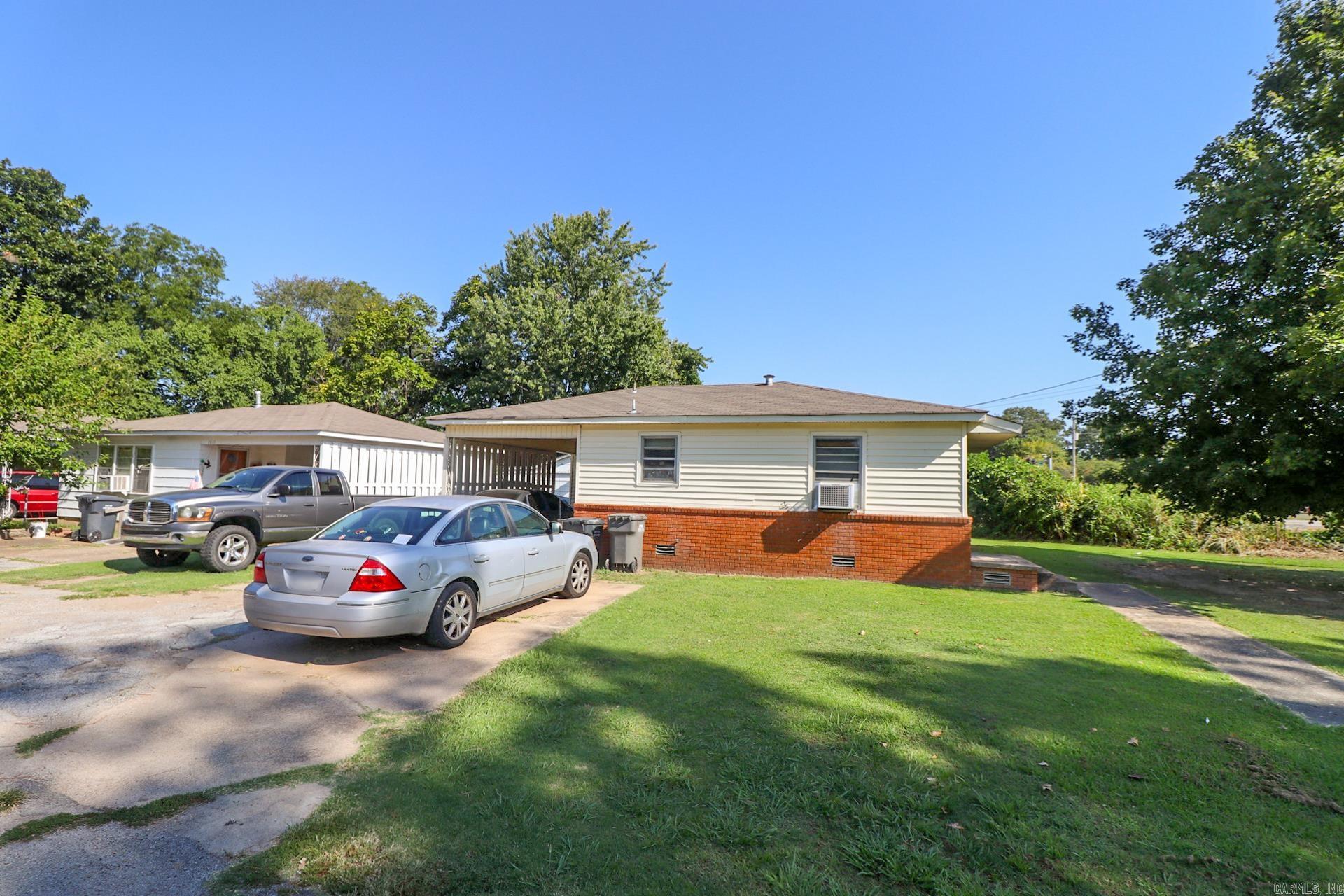 Attention Investors! Don't miss this unique opportunity to own a portfolio of six individual houses on a single lot. The property includes four 2-bedroom, 1-bath homes, and two 3-bedroom, 1-bath homes, all of which are currently leased. Additionally, the lot features a large shop and a storage unit for added value. This property is being sold as is, where is.