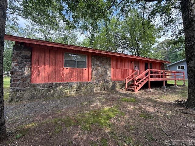 A PLACE FOR THE FAMILY AND INCOME, TOO! Your golden opportunity to own a home less than 5 minutes from DEVILS FORK PARK and access to beautiful GREERS FERRY LAKE! This ADORABLE and AFFORDABLE 2-bedroom, 2-bathroom home had new shingles installed in the spring of 21'. Open concept floor plan, with access to your oversized back deck AND side porch from the living and dining room make entertaining fun and easy! Both bedrooms offer plenty of room for play and sleep. Some updates include updated flooring, paint and hot water heater. Nicely situated on a LARGE corner lot that provides ample room to park your boat. WELL WORTH THE CALL if you are looking for a seasonal retreat or low-cost living.