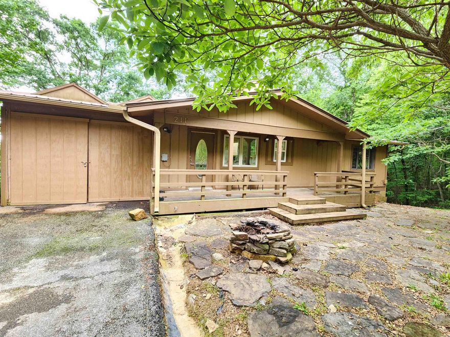 Secluded, private house with view of Sugar Loaf Mountain.  Listen to the relaxing sounds of the running creek from below while enjoying your coffee on the spacious 3 level back decks/patio.  Inside you will find updated 2 bedroom, 1 1/2 baths, great kitchen with granite countertops and all appliances and laundry on the top floor. Second floor is a completed walk out basement with kitchenette, shower, safe room and possible 3rd bedroom/game room/guest area. Plenty of parking for cars, boats, lake toys. Garage for one car/golf cart/side by side--trail riding at the end of the road. Garage has huge storage room and work area.  Monthly fees cover entry into 3 different pools, half price golf, gyms, parks, and free boat launching which is 3.5 miles from house.  Home would make a wonderful Airbnb/VRBO for nightly rental.  sq ftg is apprx. please measure.