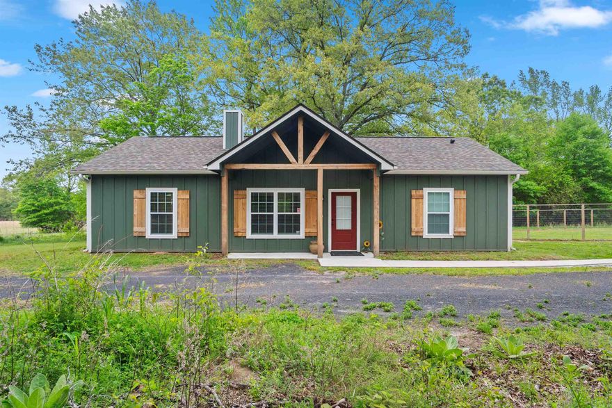 Welcome to your private country retreat! This beautifully built 2024 home offers 1240 square feet of thoughtfully designed living space, situated on 3.15 peaceful acres. Inside, you'll find luxury vinyl plank flooring throughout, granite countertops, and solid oak cabinetry, all complimented by upgraded insulation for added comfort and efficiency. A detached 20 x 20 garage provides extra storage or workspace. Enjoy the perfect blend of modern finishes and quiet country living.  This one is a must see!