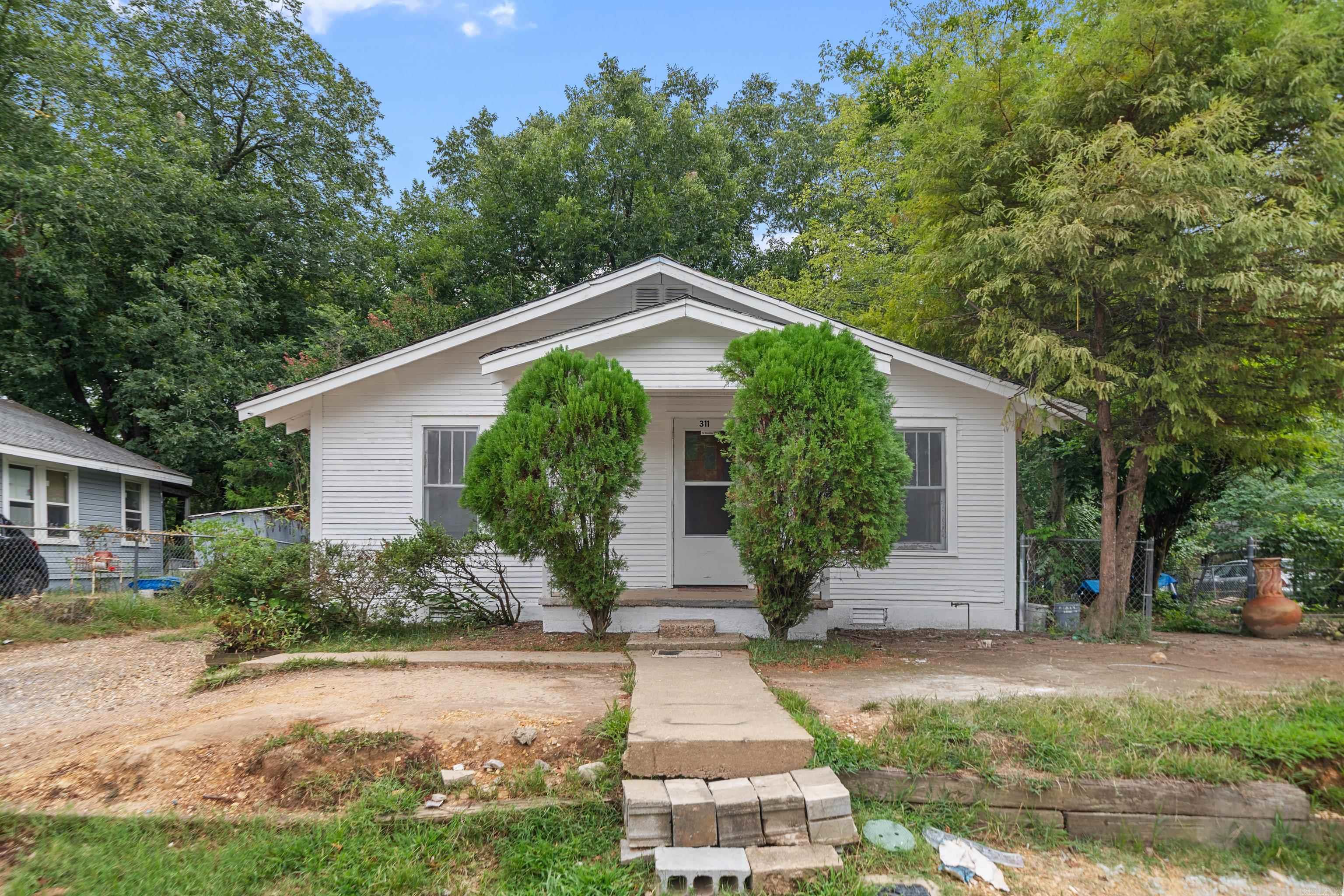Loving the look of this place! A cozy 2 bed, 1 bath that’s move-in ready and up to code. The lot is large and there's a perfect spot to build a shop or a storage building. Priced right! Don’t miss out on this one!