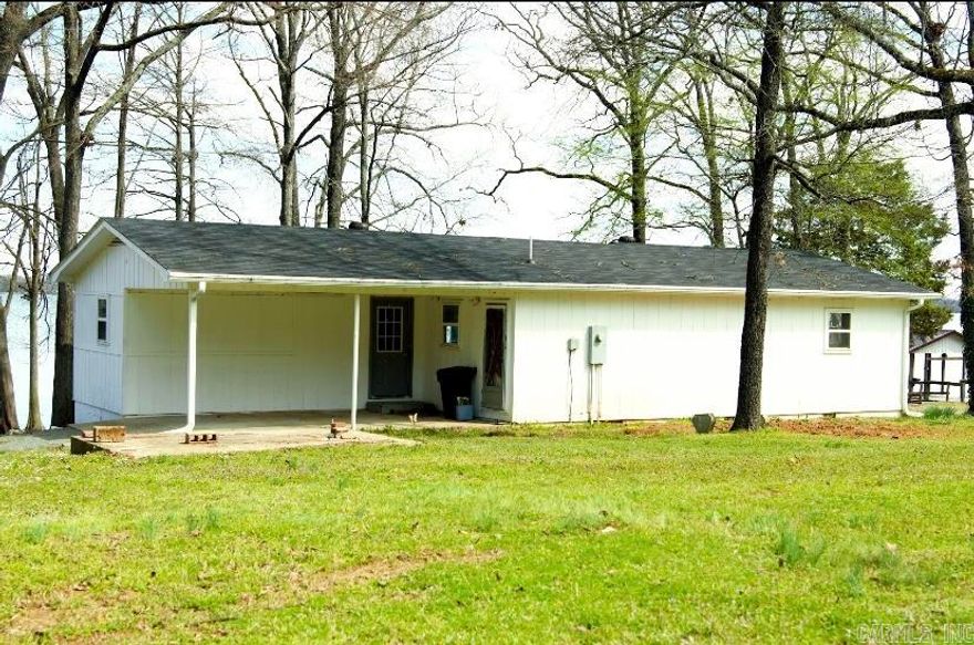 Welcome to this beautiful Lake house in Perryville! This home is nestled in a quiet neighborhood, perfect for tranquility and peace, and just the right distance outside Little Rock. The house is right across Harris lake with a dock extending right into it to enjoy the calm waters. The house has been upgraded with a new roof, new gutters and cabinets have been redone.