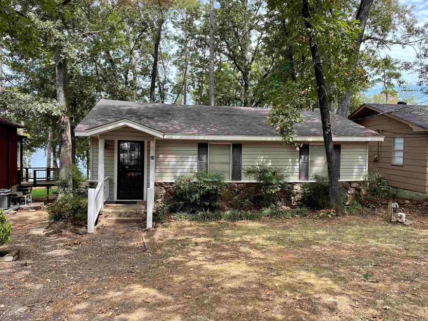 Great Lake Front Home with a Tram.  This home is located in a great neighbor hood in the old town of Higden.  Great lake access just down the road.  The tram is in good working order.  Load your boat from the deck and push a button to take you right down to the lake!!!!!