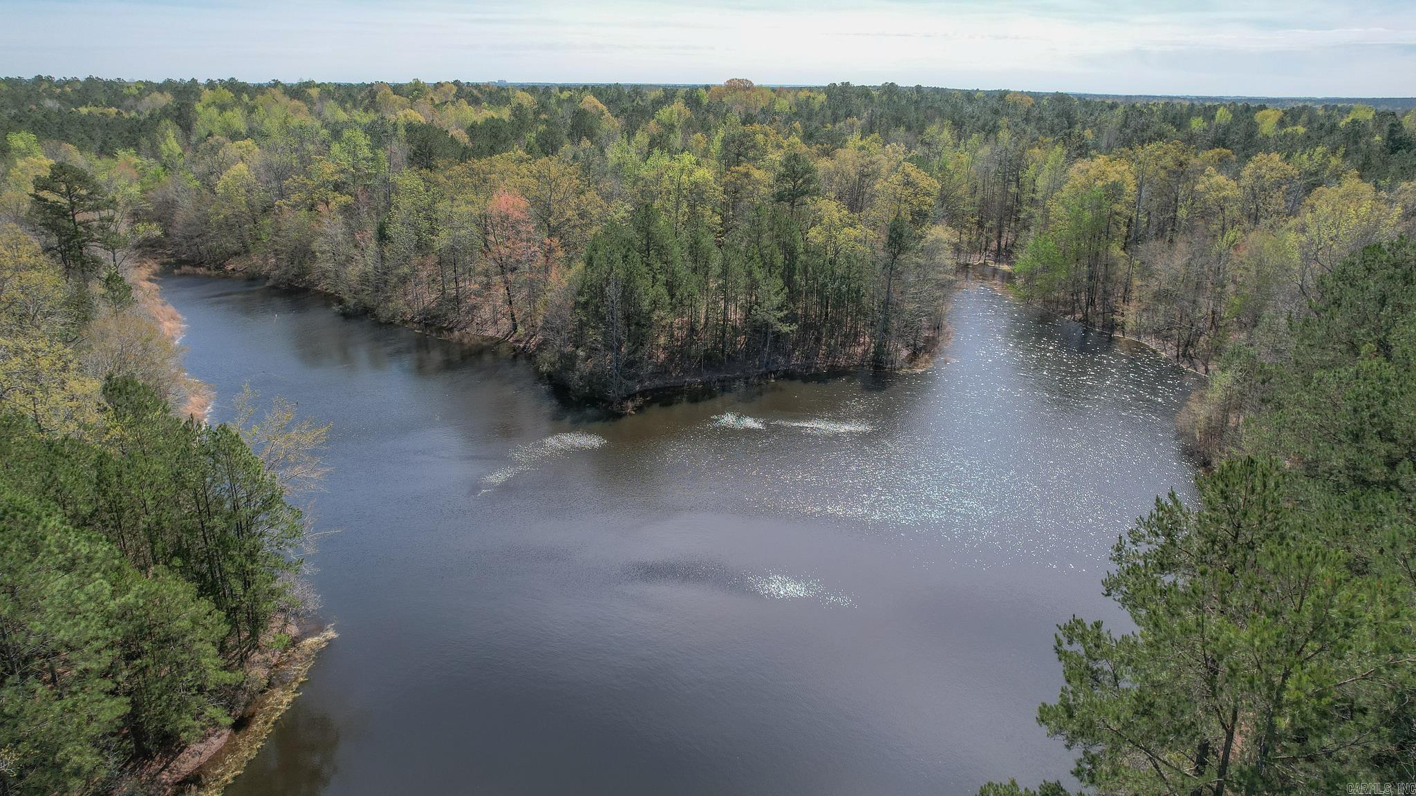 Looking for the perfect hunting land in Arkansas? Look no further than Miller County, where you'll find a beautiful property with everything you need for an unforgettable hunting experience. With a stunning 2 acre pond and multiple trails that are wide enough to drive a truck, this property is ideal for any hunting enthusiast. The rolling topography and mix of pine and hardwood timber provide the perfect habitat for a wide variety of wildlife, making it a hunter's paradise. Whether you're looking to hunt deer, turkey, or any other game, this property has it all. And when you're not out in the field, you can relax by the pond and take in the breathtaking views of the surrounding timber. Don't miss out on this opportunity to own your very own piece of hunting paradise. Contact us today to schedule a viewing and see for yourself what makes this property so special.