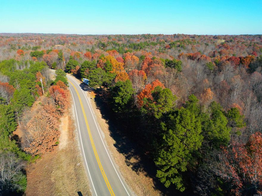 Beautiful and secluded one acre wooded tract with highway frontage on Hwy 34 West. This versatile property allows you to clear only the amount of trees you choose, giving you the perfect balance of privacy and open space. Enjoy the peace of country living while still being just minutes from shopping, dining, hiking, fishing, swimming, and so much more. A great opportunity to build your dream home with the privacy you desire!