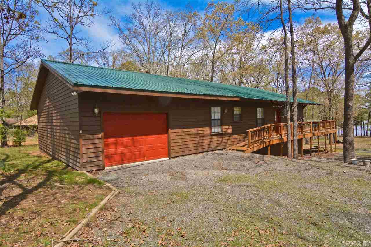 This great lake house faces east. You can watch the sunrise and moonrise over Higden Bay. Newly added third bedroom, exterior paint and metal roof. Extra large deck