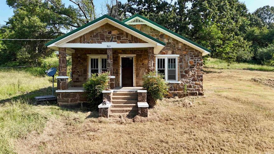 This 2 bed, 1 bath historic rock home is full of character and ready for your finishing touches. The owner has already updated the electrical and plumbing systems, kitchen cabinets, and a dishwasher. It has a newer metal roof. Sitting on a spacious 1.06-acre lot, the property also includes a storage building, metal utility building, and detached carport. Cash or in-house financing only. A great opportunity to bring this classic home back to life!