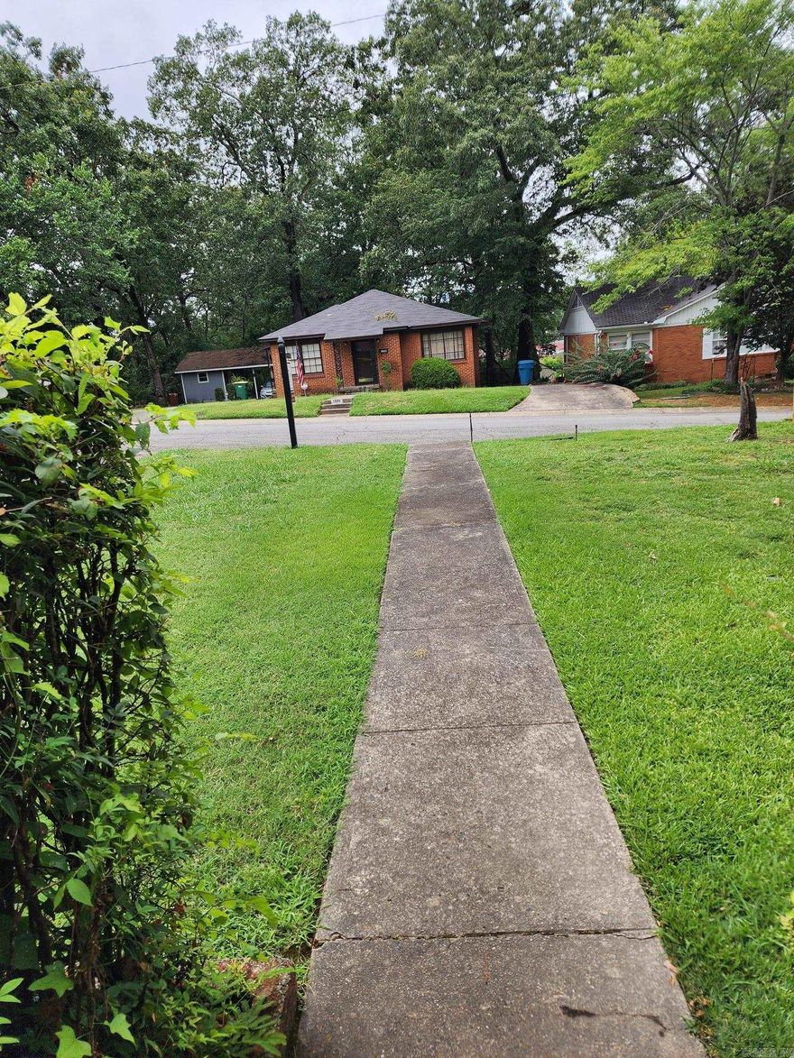 Adorable home! Near everything! two bedroom, one bath, spacious living area, dinning area, eat in kitchen, outdoor deck off kitchen and back porch! Tranquil back yard. There is a garage that needs work, it has major space and was livable at one time. See agent remarks