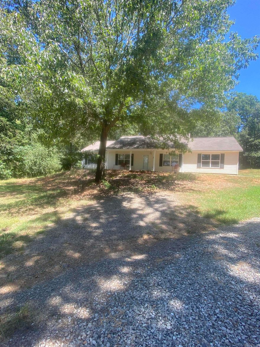 Very nice and well kept home.  Only minutes away from the convenience of Conway.  The home has 3 bed rooms with 2 full baths and 2 living areas.  Lots of counter space and a pantry in the kitchen.  In the main bathroom it has separate shower and tub.  The two car garage is almost level with the entrance into the home.  Three acres includes trees and clearing area.  Plenty of elbow room to enjoy a privacy setting with a peaceful view.  There are three storage buildings that will convey.  One of the storage buildings has a lean-to with electricity.
