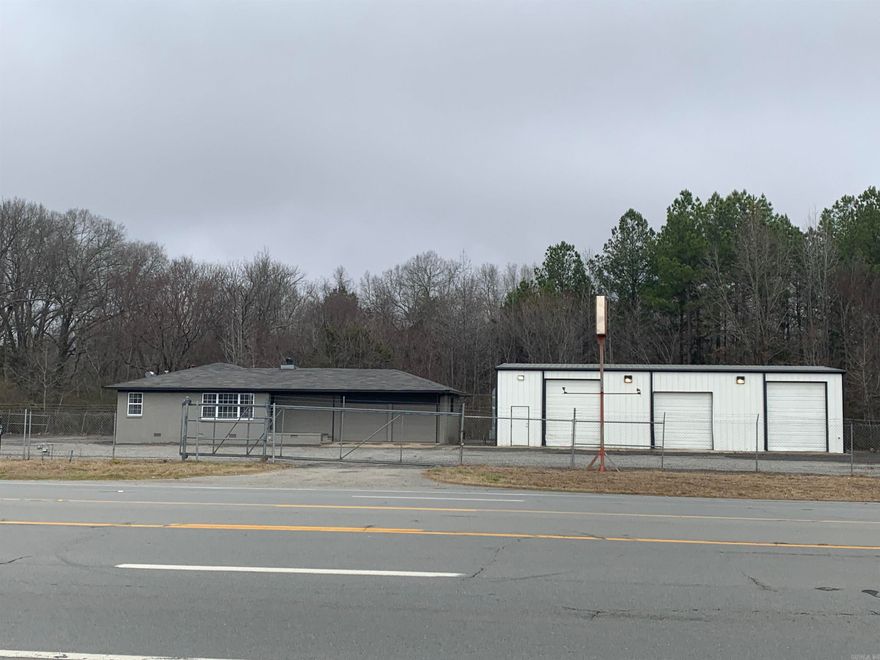 PROPERTY HIGHLIGHTS - LEASE SPACE AVAILABLE! - High Visibility. - Office has three private offices with a meeting room and entry. - Offices has new carpet and paint. - Additional two door storage faciality attached to the office. - Shop has bathroom and three large overhead doors. - Lot is fully fenced and entirely graveled. -Sliding front gate entry. -Large lot lights on building for ample illumination of lot.