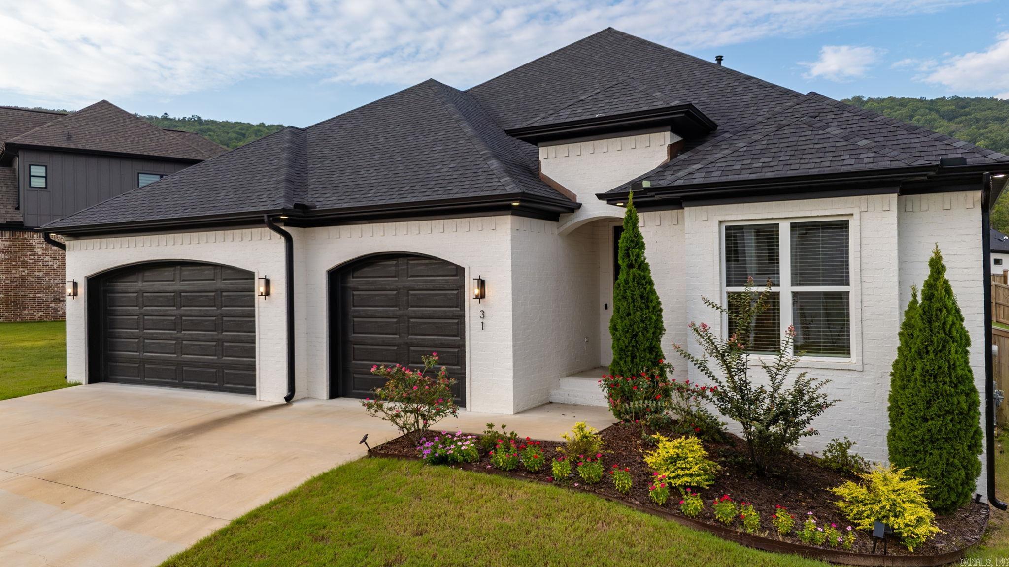 Spectacular one level in the beautiful neighborhood of Corlay Court in Chenal Valley! Custom built, mint condition with attention to every detail. Fabulous open floor plan with light filled modern decor, the perfect setting for family living and entertaining. Banquet sized dining area that flows into Spacious family room with fireplace, Gourmet kitchen with quality appliances, large island and loads of custom cabinets. Gorgeous spa inspired primary suite with luxurious bath and large walk in. 3 guest bedrooms and two additional baths. Wonderful large lot with covered terrace perfect for outdoor cookouts! 3 Car Garage - A must See!