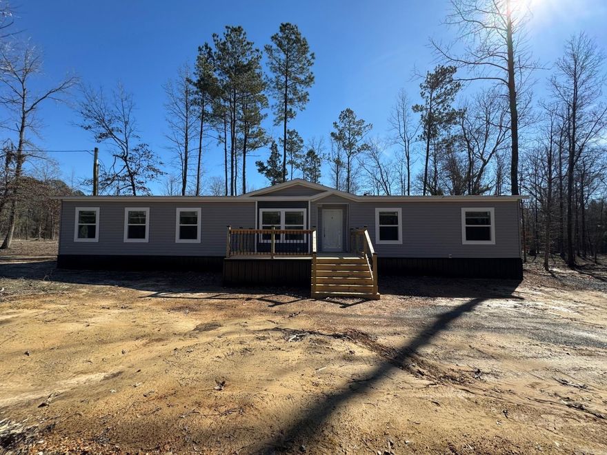 THIS HOME QUALIFIES FOR $0.00 DOWN USDA LOAN.  We have lenders offering low rates and buy down points on this home.   4 bedroom 2 bath Brand new manufactured home constructed on 1.86 acres.    All new appliances, new titian underpinning, new hvac, new water lines, septic, electric. front and back decks. Home is on a permanent foundation.  Home is energy smart and comes with a 1 year manufactured home warranty from the dealership. All service will be taken care with the service dept at the local dealership.  Be the first family to call this beautiful home yours!  Listing agent can recommend lenders for a home loan.  **Agents see remarks**