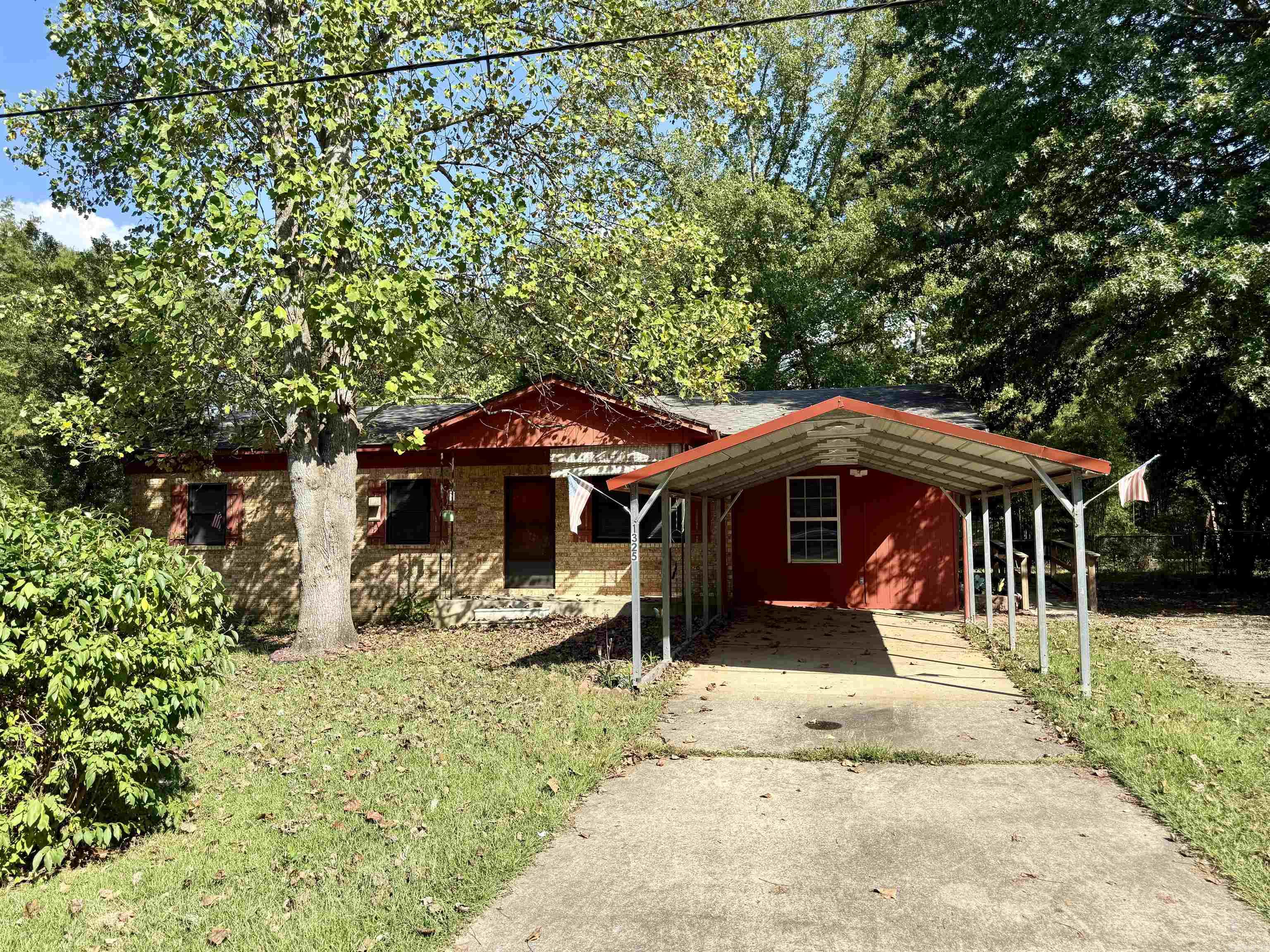 Take a look at this 3 bedroom, 1.5 bath, optional bonus room could be a 4th bedroom. Covered carport, ramp to the side entrance, 2 storage buildings in the fenced backyard. Great starter home, retirement or investment opportunity. Agents See Remarks.