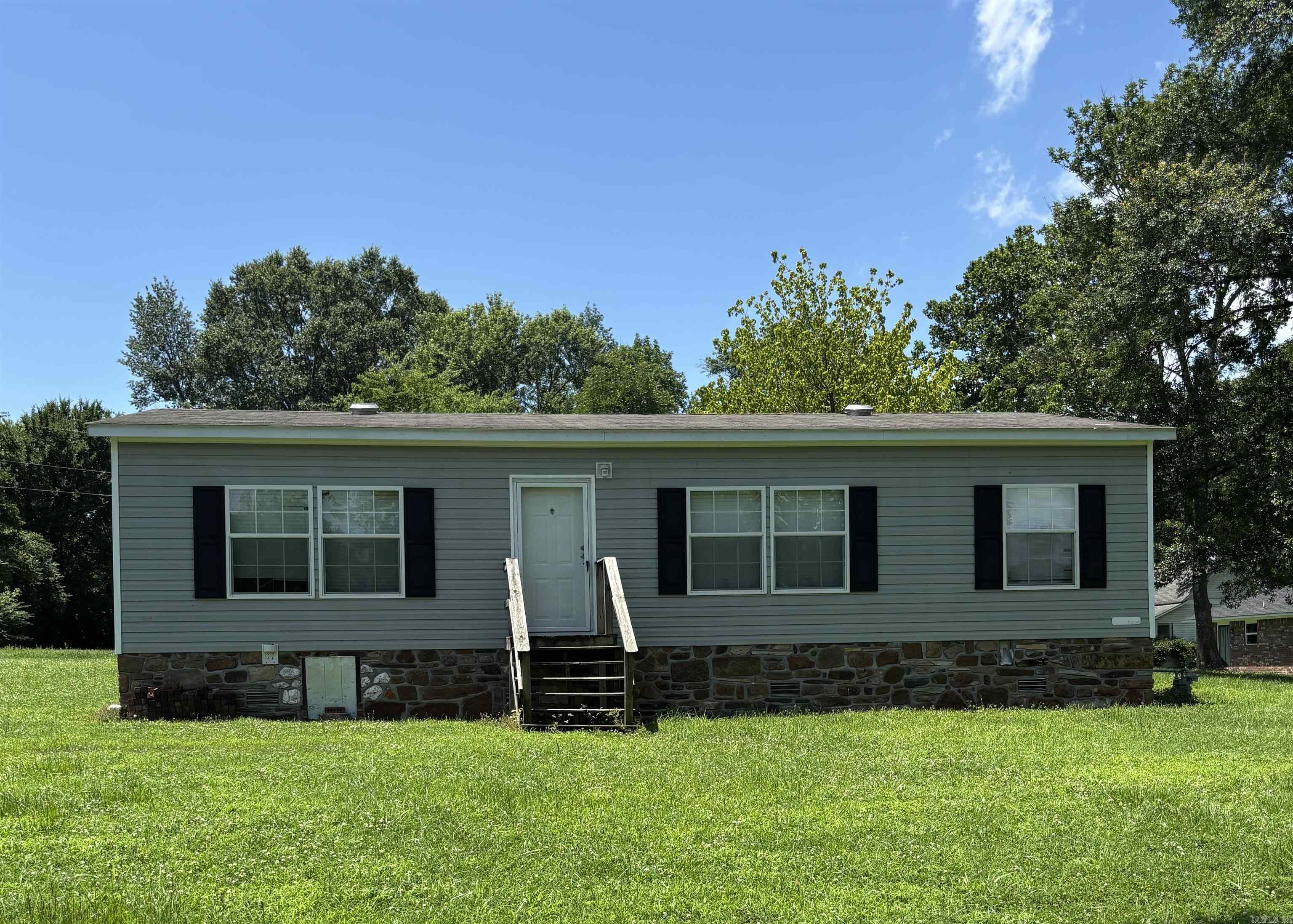Welcome home to this charming 3-bedroom, 2-bath mobile home that offers 1,232 square feet of living pleasure, nestled right here in the Lamar city limits. It features an open concept living and dining area, spacious kitchen with a dishwasher included. It has beautiful rock underpinning for added curb appeal along with cement runners the width of the mobile home. All city utilities are in place and has easy access to schools, shops and park.